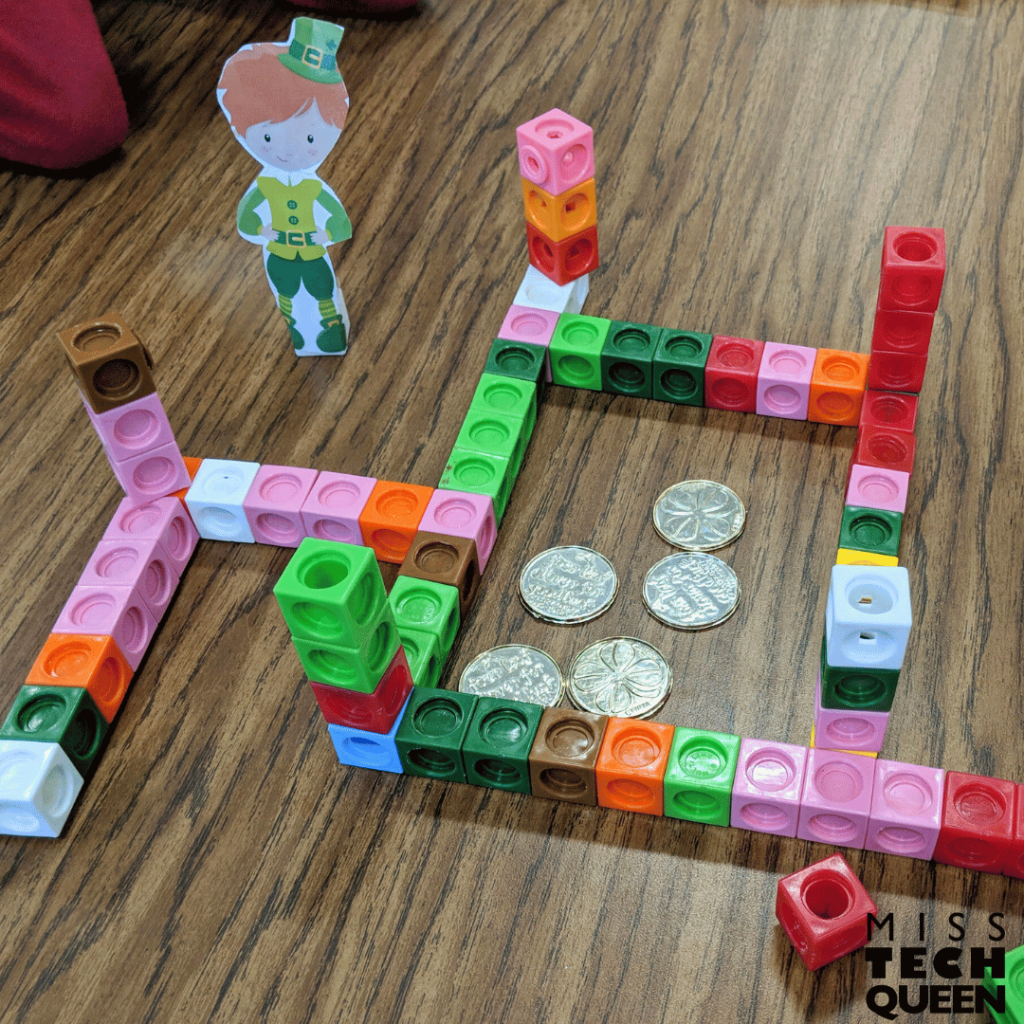 This photo shows easy stem activities in which students will use plastic math cubes to build a leprechaun maze with gold as the middle.